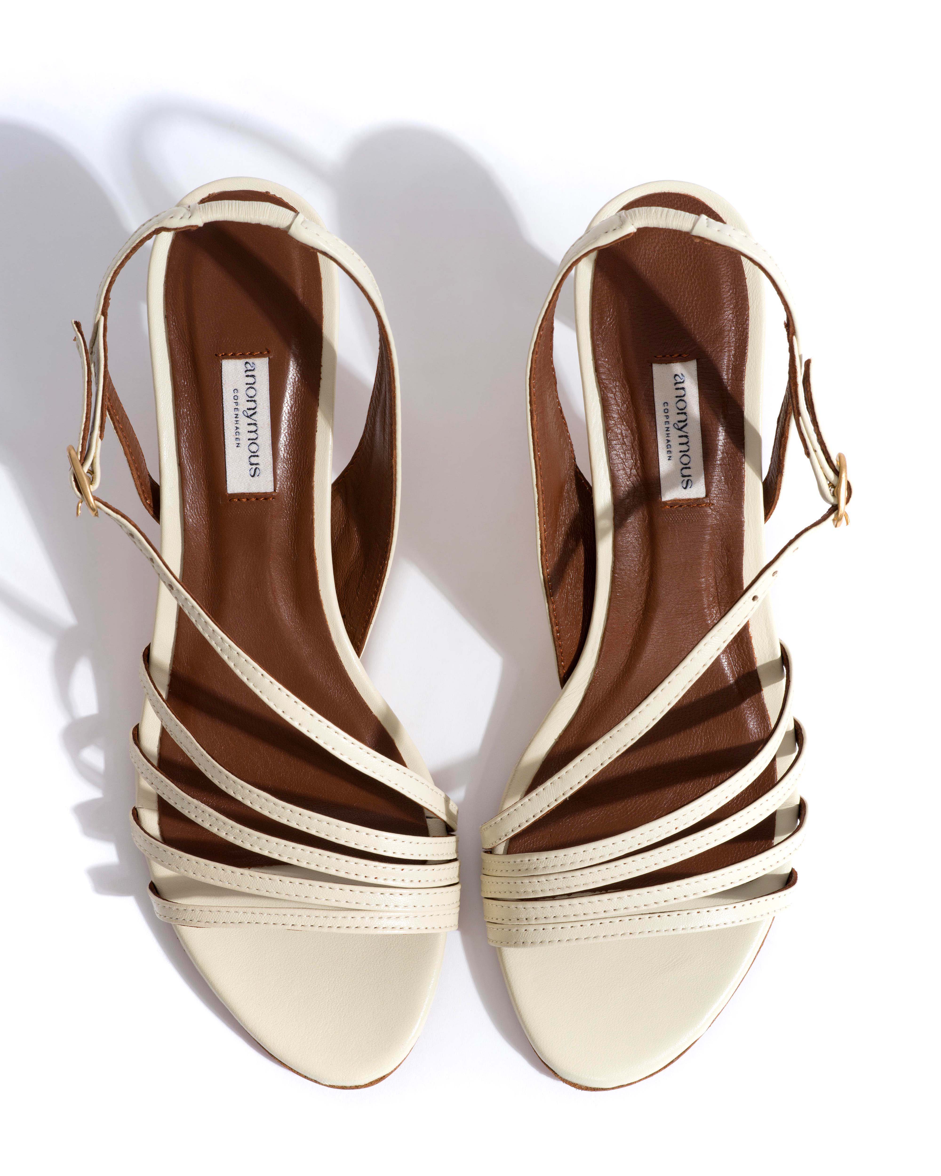 Naia 55 Shiny lamb White sand